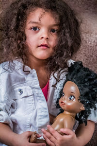 Portrait of cute girl with toy