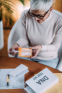 Midsection of woman working on table