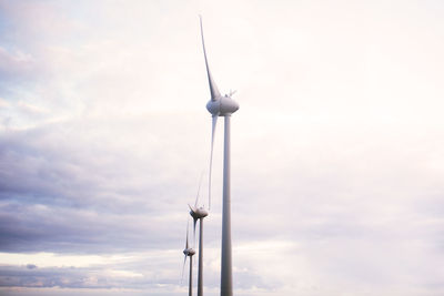 Low angle view of windmill against sky