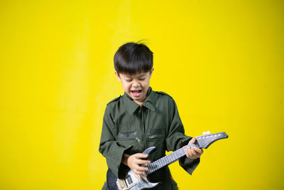 Portrait of a man holding guitar