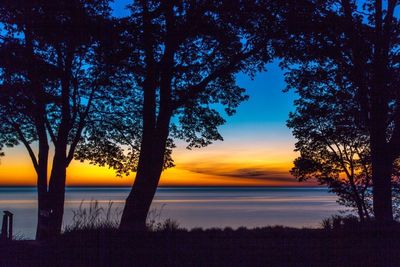 Scenic view of sea at sunset