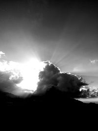 Low angle view of silhouette trees against sky