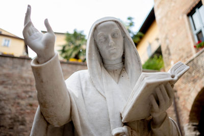 Close-up of statue against building