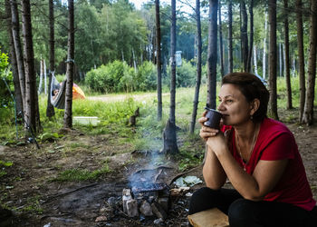 Man sitting in forest