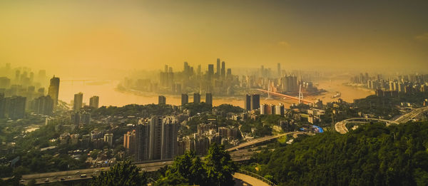 High angle view of city at sunset