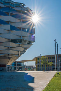 View of buildings against blue sky on sunny day