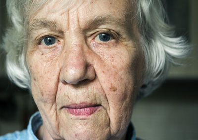 Close-up portrait of senior woman indoor