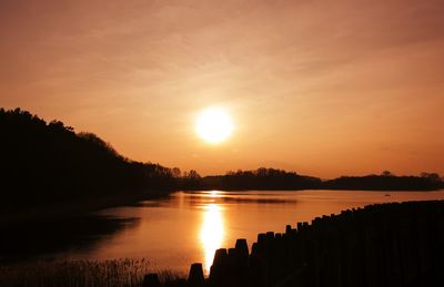 Scenic view of sunset over river