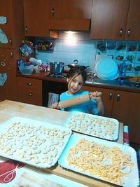 Boy standing in tray