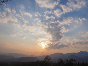 Scenic view of silhouette mountains against sky during sunset