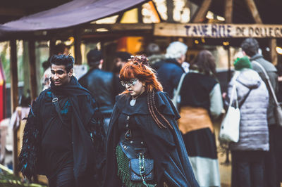 People walking at market in city