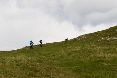 People riding bicycle on mountain 