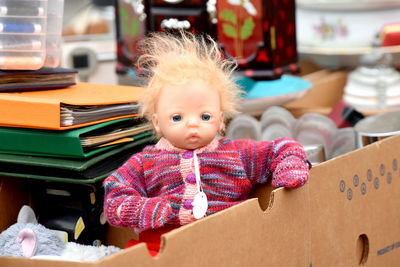 Portrait of cute baby girl in box