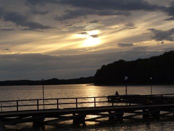 Scenic view of lake against sky during sunset