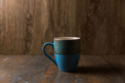 Close-up of coffee cup on table