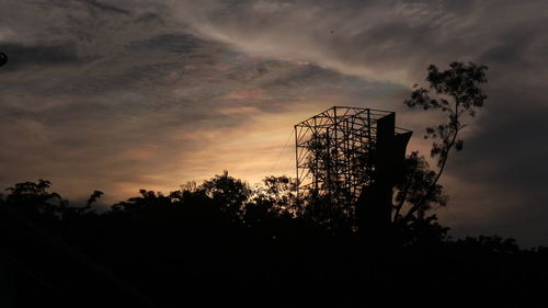 Low angle view of silhouette trees against sky at sunset