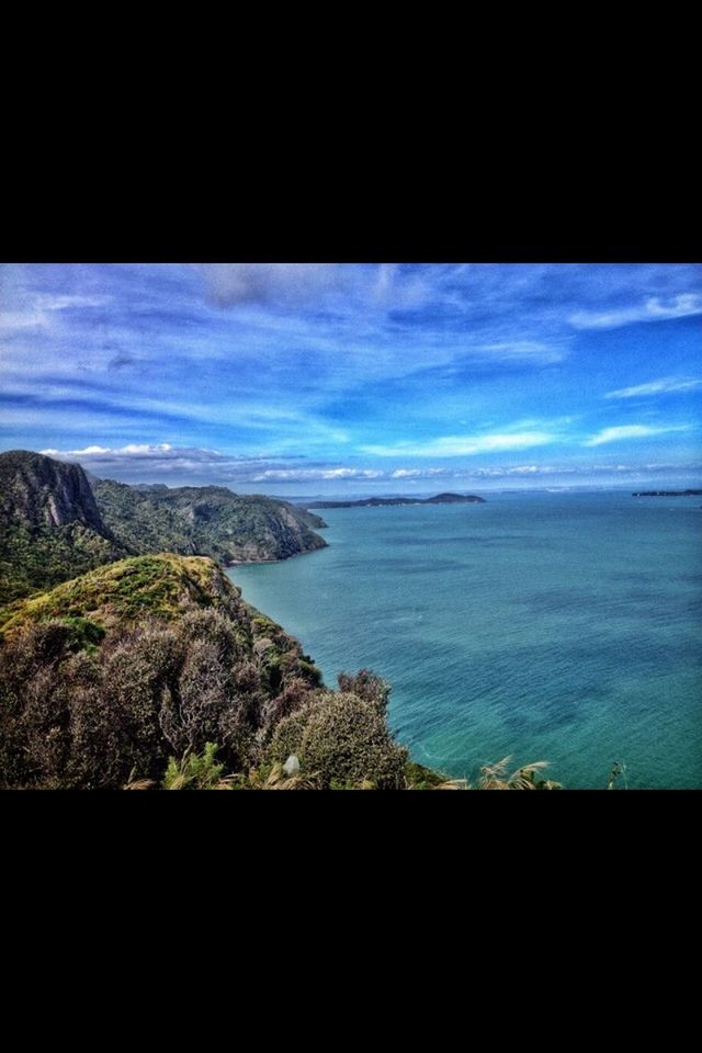 sea, scenics, water, tranquil scene, beauty in nature, tranquility, sky, horizon over water, nature, idyllic, blue, transfer print, cloud - sky, auto post production filter, cloud, coastline, seascape, calm, mountain, outdoors