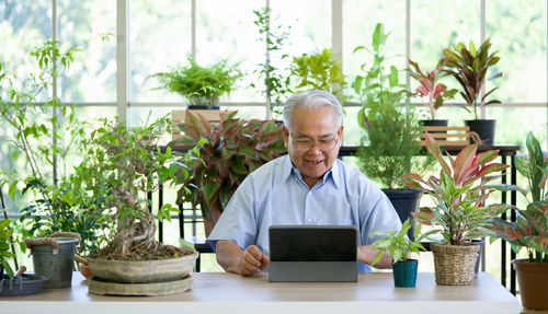 Portrait of man sitting in pot