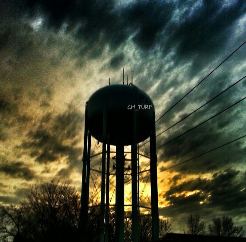 sky, low angle view, cloud - sky, cloudy, cloud, weather, silhouette, overcast, dusk, sunset, street light, dramatic sky, pole, lighting equipment, connection, outdoors, tree, no people, power line, nature