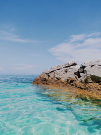 Scenic view of sea against blue sky