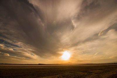 Scenic view of landscape against sky during sunset