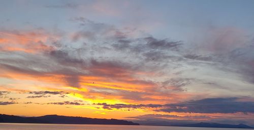 Low angle view of dramatic sky during sunset