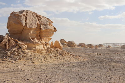 Rock formations in desert against sky