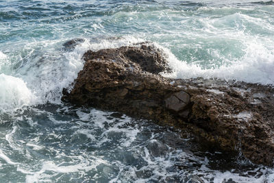 High angle view of rocks in sea