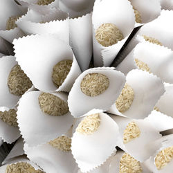 Full frame shot of raw rice in conical shape papers