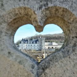 Close-up of heart shape against built structure