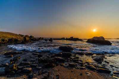 Scenic view of sea against sky during sunset