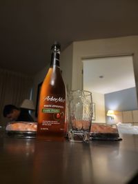 Glass of bottles on table