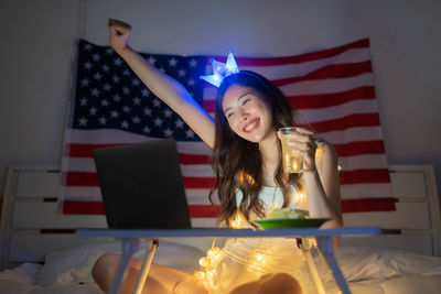 Portrait of a smiling young woman at home