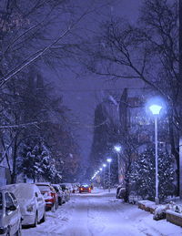 Snow covered road at night