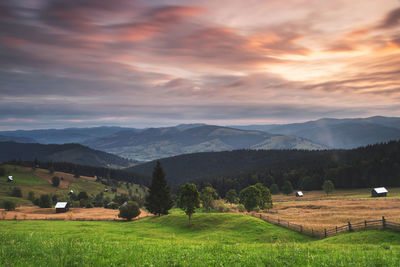 Scenic view of landscape against sky during sunset