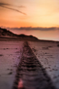 Scenic view of beach against sky during sunset