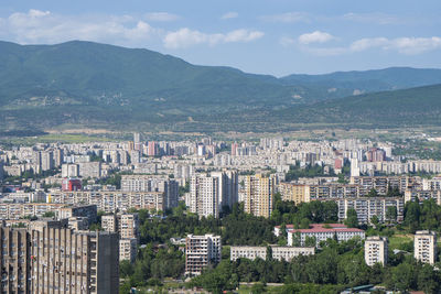 High angle view of buildings in city against sky