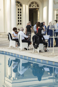 People sitting in swimming pool