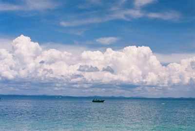 Scenic view of sea against cloudy sky