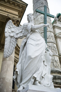 Low angle view of statue against sky