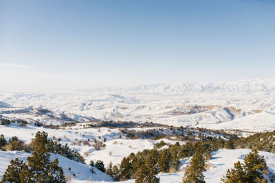 Panorama of snowy slopes covered with snow in sunny weather. winter landscape in the mountains