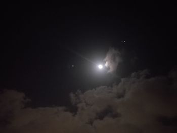 Low angle view of moon in sky at night