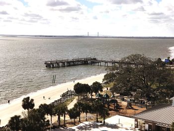 Scenic view of sea against sky in city