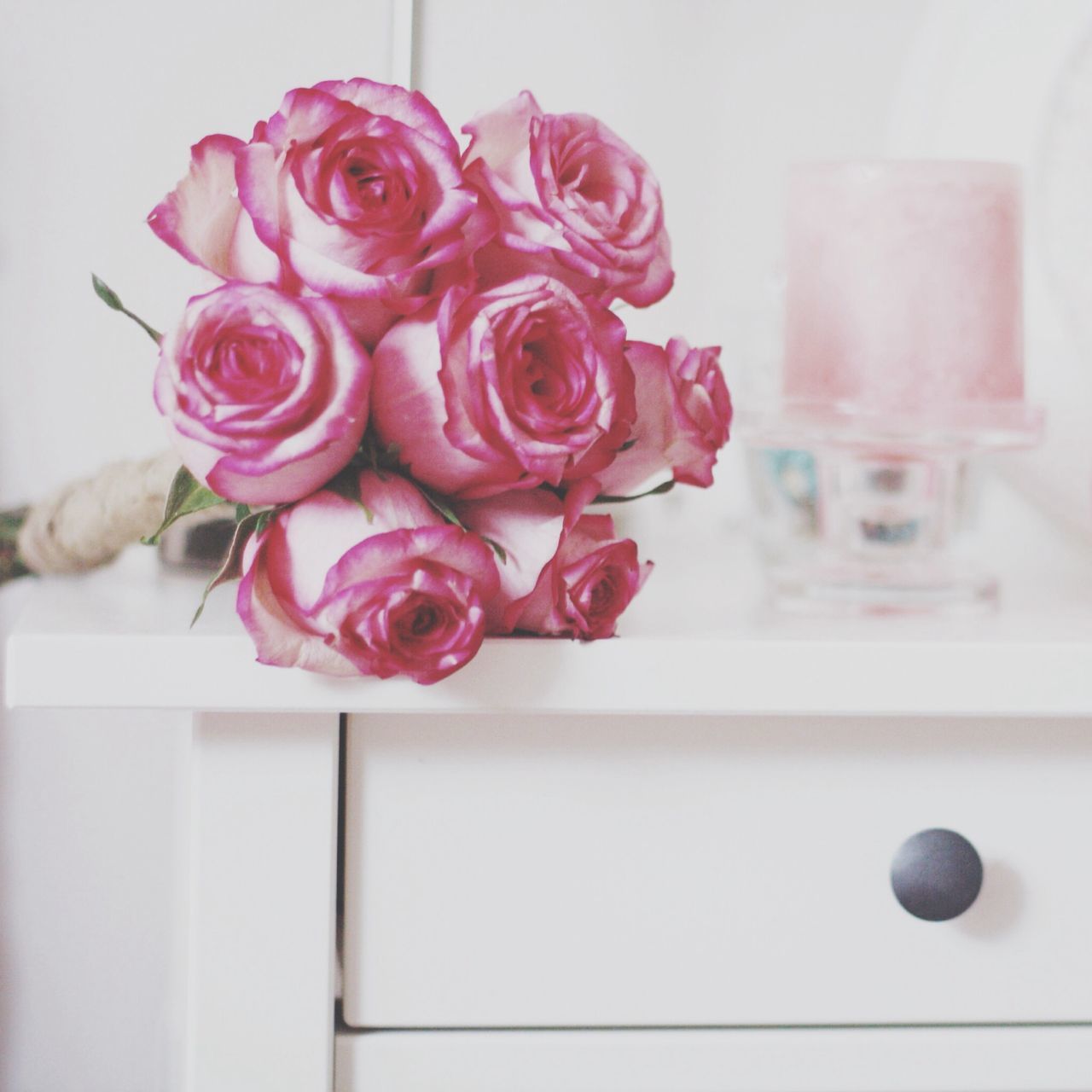 indoors, flower, vase, red, table, rose - flower, pink color, freshness, home interior, still life, close-up, petal, fragility, decoration, rose, flower head, wall - building feature, no people, pink, flower arrangement