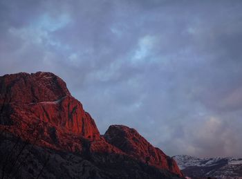 Low angle view of rock formation against sky