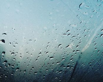 Full frame shot of raindrops on rainy day