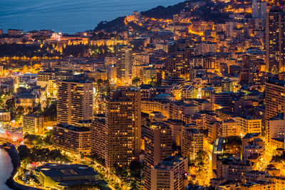 High angle view of illuminated cityscape at night