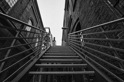 Low angle view of staircase in building against sky