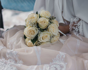 High angle view of white roses in bouquet