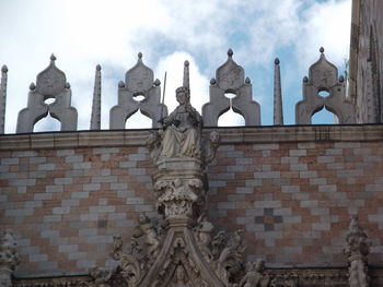 Low angle view of statue against sky